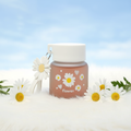 Daisy flower glass bottle lifestyle shot with white daisies